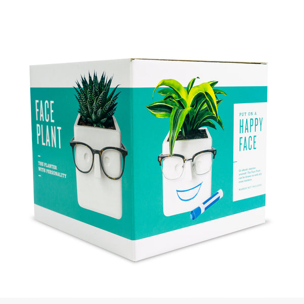 Face Plant Package teal colored planter with eyeglasses left planter happy face with marker on right