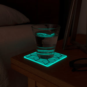 Glow in the dark coaster modern lamp glass of water on nightstand table bed on left