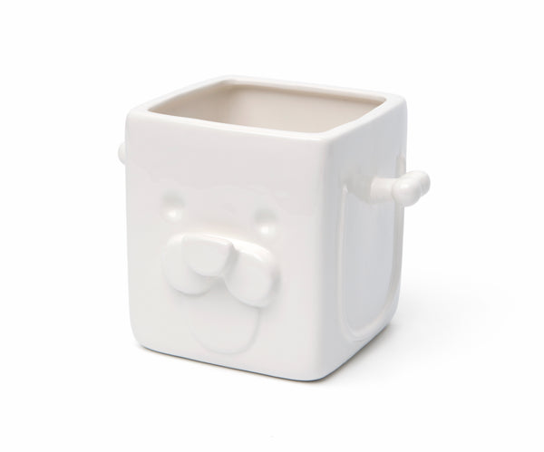 Empty white square planter with cute puppy face 